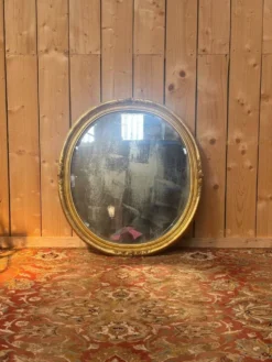 Miroir ovale biseauté bois doré style Louis XVI XIXe siècle