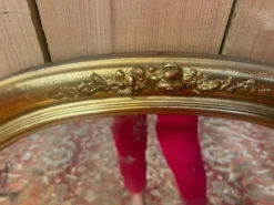 Miroir ovale biseauté bois doré style Louis XVI XIXe siècle