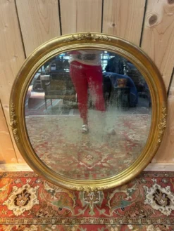 Miroir ovale biseauté bois doré style Louis XVI XIXe siècle