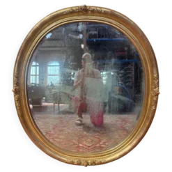 Miroir ovale biseauté bois doré style Louis XVI XIXe siècle
