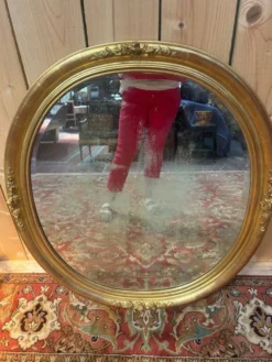 Miroir ovale biseauté bois doré style Louis XVI XIXe siècle