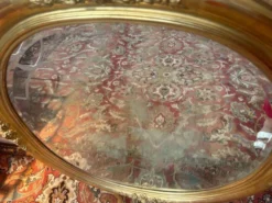 Miroir ovale biseauté bois doré style Louis XVI XIXe siècle