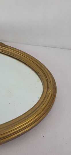 Miroir ovale en bois doré, style Louis XVI