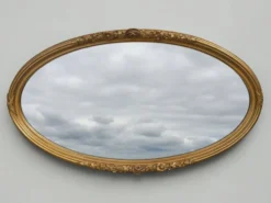 Miroir ovale en bois doré, style Louis XVI