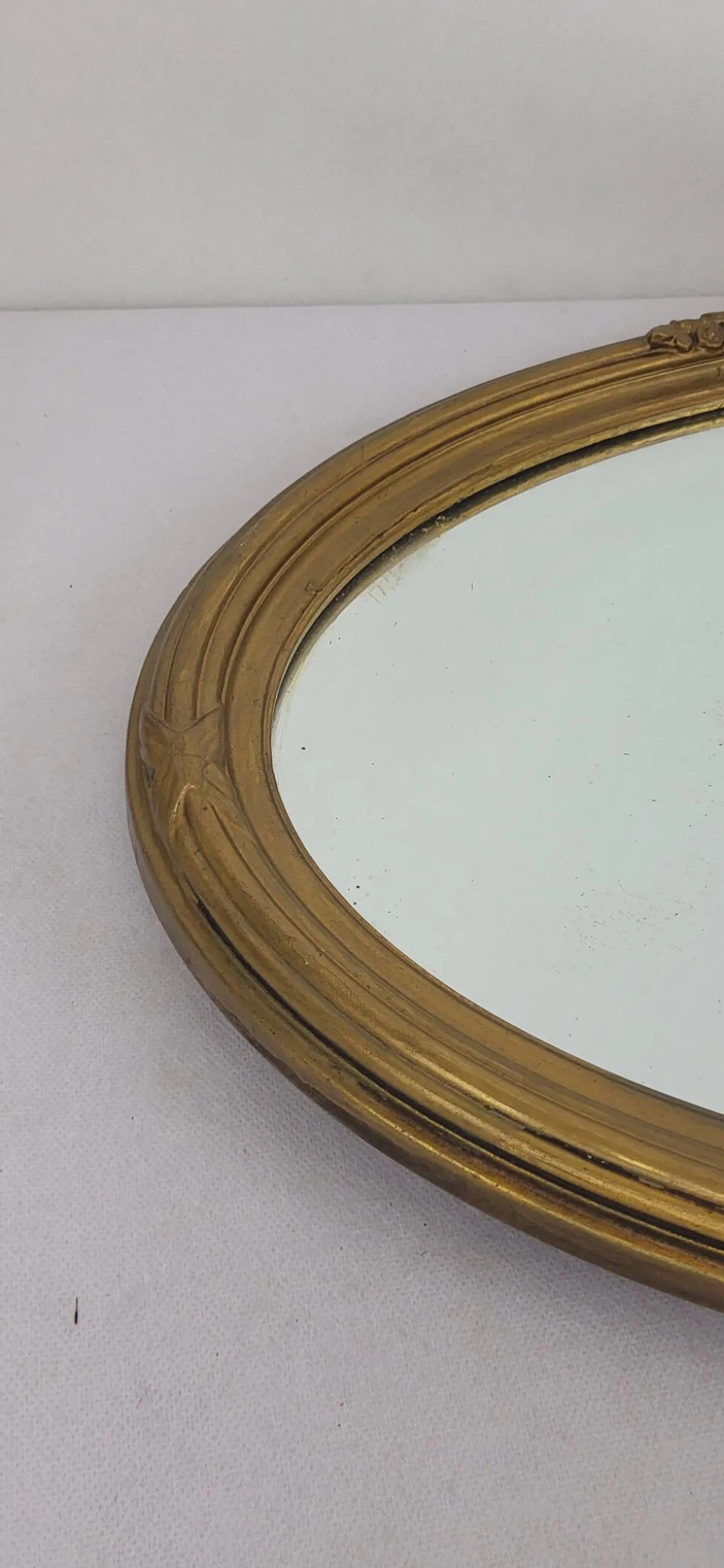 Miroir ovale en bois doré, style Louis XVI