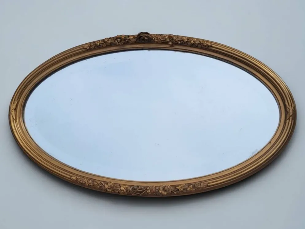 Miroir ovale en bois doré, style Louis XVI