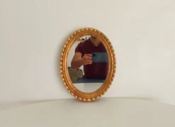 Miroir ovale italien vintage en bois doré