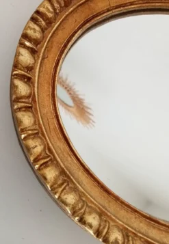Miroir ovale italien vintage en bois doré