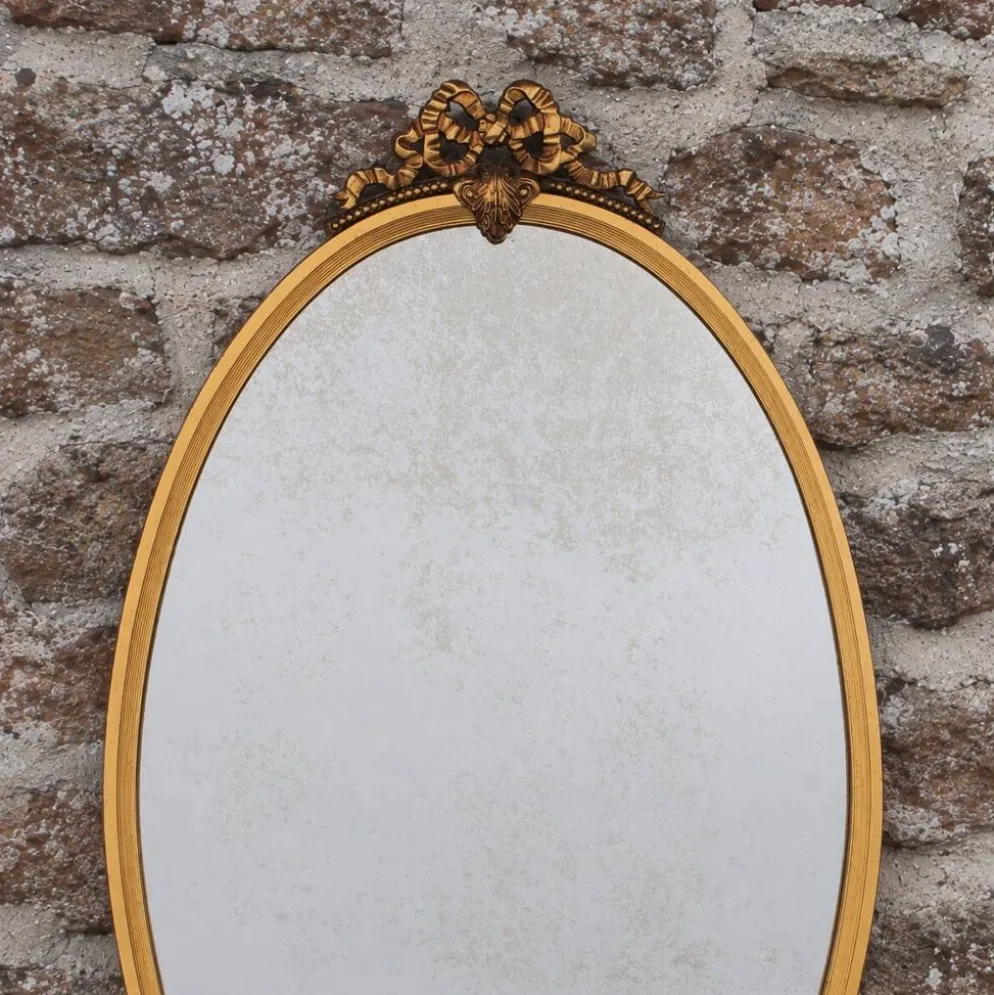 Miroir ovale vintage en métal doré à nœud – style Louis XVI / romantique