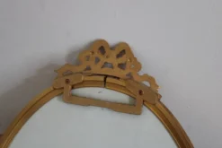 Miroir ovale vintage en métal doré à nœud – style Louis XVI / romantique