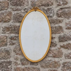 Miroir ovale vintage en métal doré à nœud – style Louis XVI / romantique