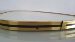 Miroir ovoïde vintage bords doré et noir - années 1960