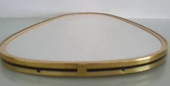 Miroir ovoïde vintage bords doré et noir - années 1960