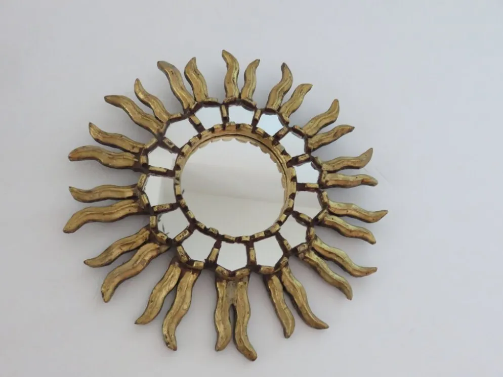 Miroir soleil en bois doré avec incrustations début XXème