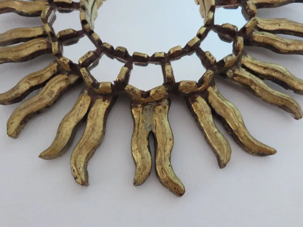 Miroir soleil en bois doré avec incrustations début XXème