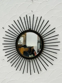Miroir soleil vintage en métal noir et doré années 60