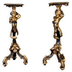 Paire de sellettes en bois sculpté, patine noire et dorée vers 1900
