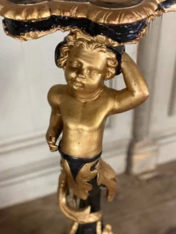 Paire de sellettes en bois sculpté, patine noire et dorée vers 1900