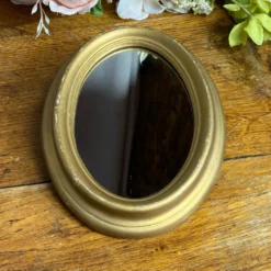 Petit miroir de forme ovale italien