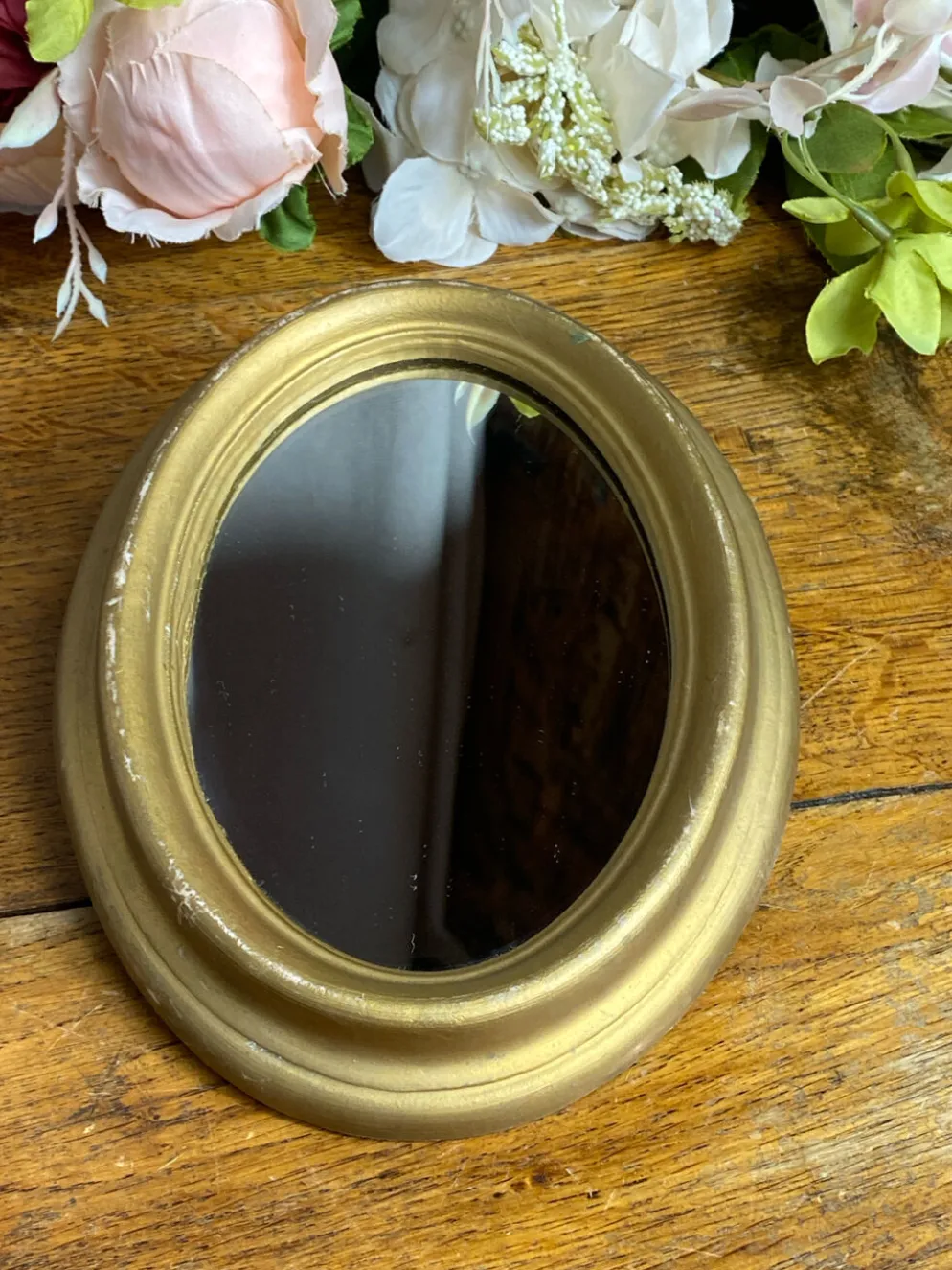 Petit miroir de forme ovale italien
