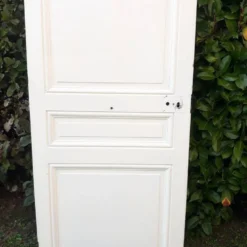 Porte de communication ancienne panneautée et moulurée