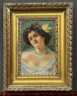 Portrait d'une jeune femme. Signé Nevelli.