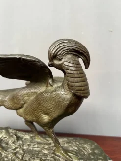 Rene Andre Varnier. Figure en bronze d'un faisan sur une base en marbre vert.