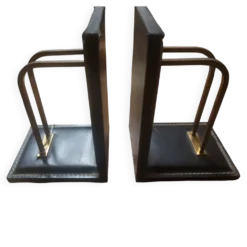2 serres-livres modernistes en cuir piqué attribué à Jacques Adnet