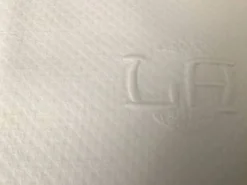 12 serviettes en damassé blanc au monogramme LA