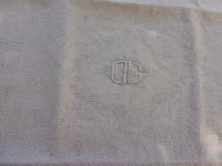 6 serviettes rectangulaires, en coton damassées, teinte Lilas et monogrammées OG, art deco
