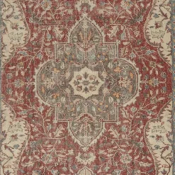 Tapis d'aire turc rouge vintage. Tapis en laine noué à la main avec un design de médaillon.