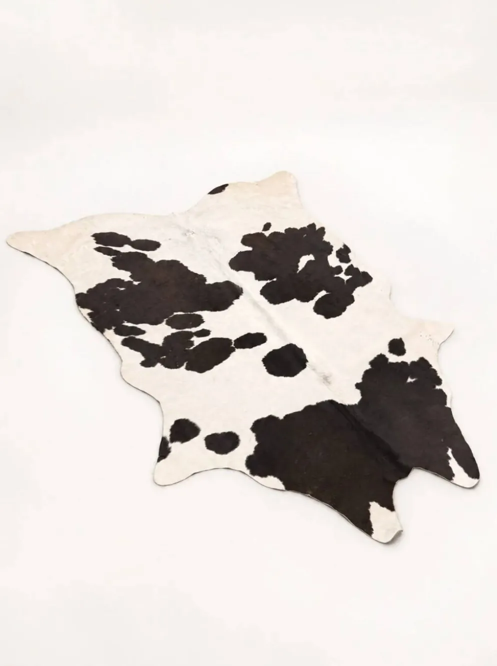 Tapis en peau de vache véritable noir et blanc