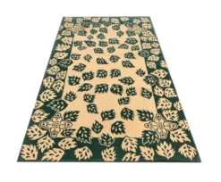 Tapis vert moderne fait main en laine crème, motif feuilles