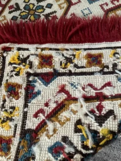 Tapis vintage en laine et frange
