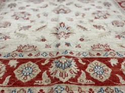 Tapis Ziegler crème à bordure rouge, tapis oriental floral en laine noué à la main
