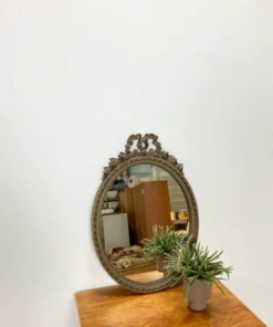Vintage wooden mirror with arch and flowers