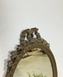 Vintage wooden mirror with arch and flowers