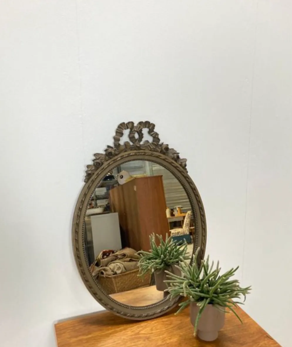 Vintage wooden mirror with arch and flowers